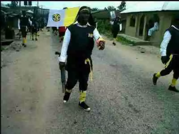 Unbelievable! Cultist Spotted Walking With Gun Publicly During Funeral Procession Of Their Member (Photo)